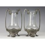 A pair of Art Nouveau pewter mounted glass vases, stamped 'Urania', Hutton Sheffield, No 1347, 19.