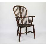 A 19th century ash and elm Windsor type chair, with pierced splat and saddle seat, on turned legs,