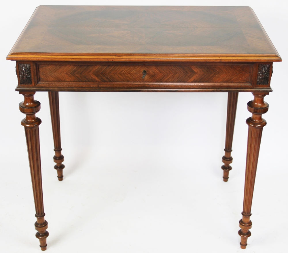 A late 19th century French carved rosewood side table, with quarter veneered top over a drawer,