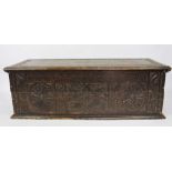 A carved oak coffer, 40cm H x 123cm W x 45cm D,