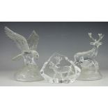 A selection of three glass paperweights comprising;