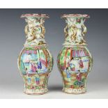 A pair of 19th century Chinese Canton famille rose enamelled vases,