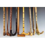 A selection of ten assorted walking sticks, to include one modelled as a golf club,
