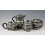 A late 19th/early 20th century century black Yixing and pewter mounted four piece tea service,