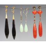 Three pairs of drop earrings, to include; a pair of carnelian set drop earrings (at fault),