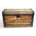 A late Victorian ash bound domed top trunk, enclosing a silver plate wine cooler, two clocks,