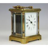 A late 19th century French brass carriage time piece, with enamel Roman numeral dial (at fault),