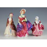 Three Royal Doulton figures, comprising, Paisley Shawl HN1988, Lady April HN1958,