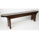 A late 19th century stained pine bench, with rounded ends,