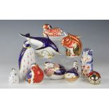 Eleven Royal Crown Derby animal paper weights, comprising a Quail, Wren, Peacock, Robin, Dolphin,