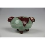 A Chinese ink pot, in a mottled sung de boeuf and celadon glaze, (cracked),