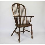 A 19th century ash and elm Windsor type chair, the pierced splat with acorn detailing,