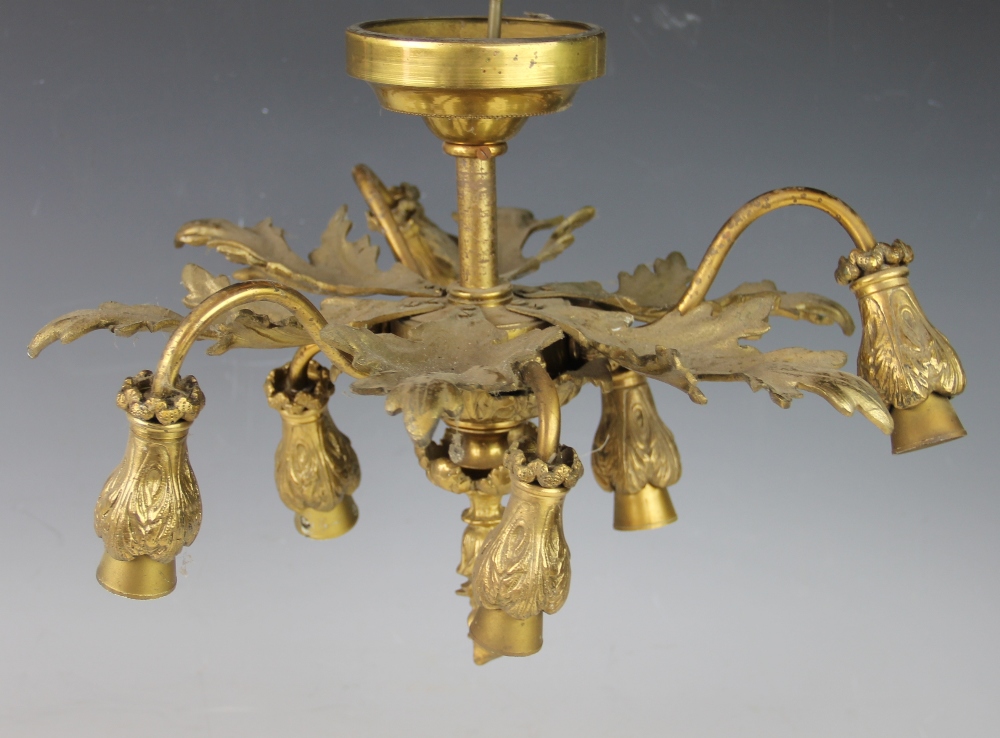 A cast brass six branch ceiling light, modelled with acanthus leaves,