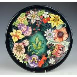 A Moorcroft Carousel pattern charger, c.