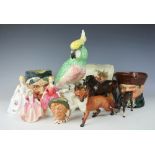 A Beswick model of a bay mare, a Beswick fox, a foal, three Royal Doulton figures,