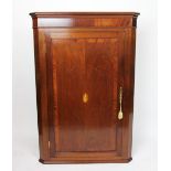 A George III style inlaid mahogany corner cabinet,