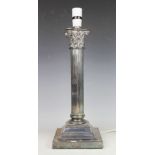A silver plated lamp base, designed as a Corinthian column, on stepped base, 39.