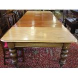 A Victorian mahogany extending dining table, with moulded edge and rounded corners,
