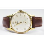 A gentlemans 9ct gold Marvin wristwatch, baton and numeral dial with subsidiary seconds,