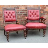 A pair of late Victorian walnut and red leather library chairs, with button backs,