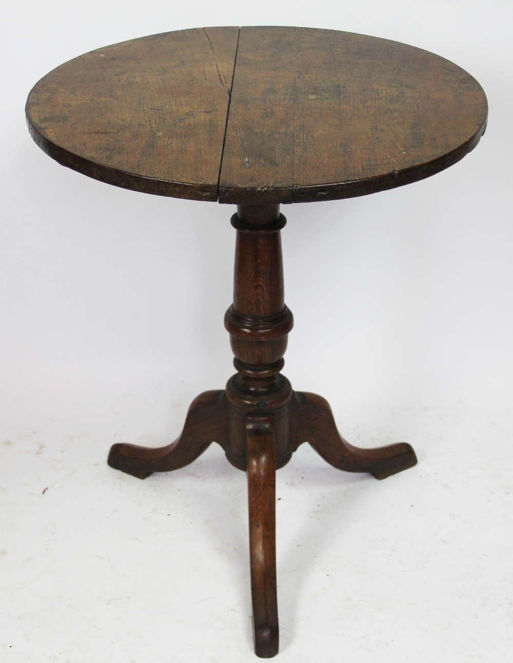 A late George III oak tripod table, 67cm H x 55cm W,