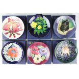 A collection of six Moorcroft pin dishes comprising; Black Tulip 1992, Frangipan 1999,