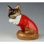 A Royal Doulton Fox in Hunting Dress HN100, wearing red coat and bow tie, (extensive cracks) 15.