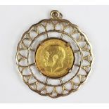 A George V gold sovereign dated 1911, within 9ct yellow gold pendant surround, gross weight 16.