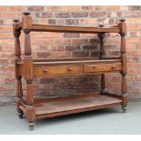 A Victorian carved oak three tier buffet with two drawers, 112cm H x 120cm W x 50cm D,