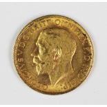 A George V gold sovereign,