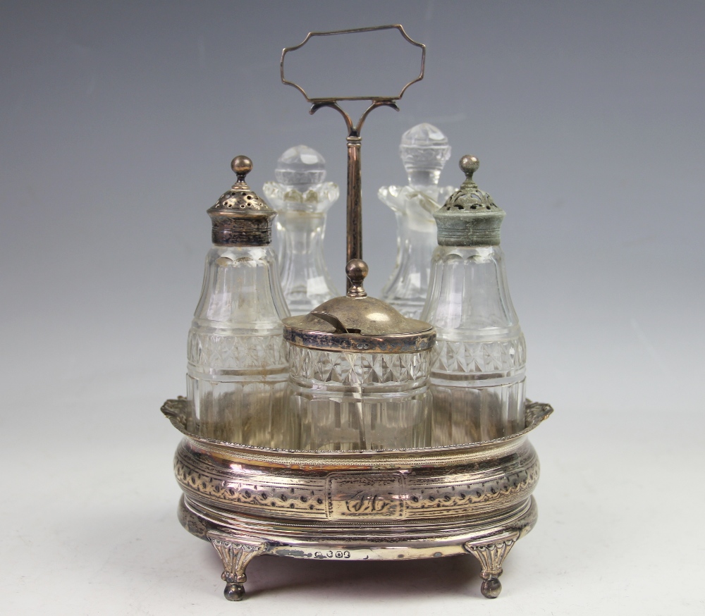 A George III silver five piece cruet stand,