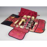 A ladies travelling vanity set, early 20th century, the leather folio type case initialled 'E.