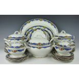 A Wilton Ware part dinner service, decorated with a border of fruit swags against a blue ground,