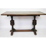 A 17th century style oak refectory table on carved baluster legs,
