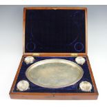 An assembled cased silver salver and salt set,