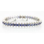 A diamond and sapphire set bracelet, designed as thirty eight untested sapphires,