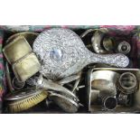 A quantity of silver wares to include cigarette cases, candlesticks,