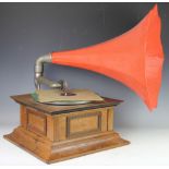 An early 20th century gramophone, with oak case with brass greek key decoration,