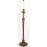 A gilt wood standard lamp, with fluted column, on circular base,