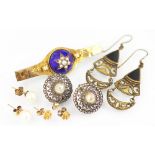A selection of jewellery, to include; a blue enamel and seed pearl set bar brooch,