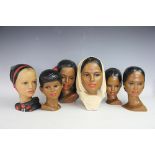 Six Edith Pedersen painted plaster heads, each of a different female nationality,