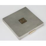 A Mellerio Dits Meller, Paris silver and gold powder compact, circa 1940, of square form,