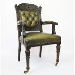 An early Victorian carved and stained mahogany library chair,