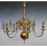 A Dutch style brass eight light chandelier,