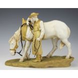 A Royal Vienna figural model by Ernst Wahliss, designed as a horse standing besides farrier,