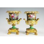 A pair of continental 19th century porcelain urn vases,