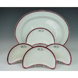 A selection of Furnival crested dinner wares, comprising nine crescent shaped side plates,