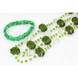 An art deco green and clear faceted glass bead necklace and a jade coloured bead bracelet (2)