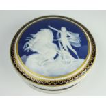 A French Tharaud Limoges pâte-sur-pâte circular box and cover,