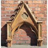 An Ecclesiastical carved and painted oak arch, (reduced),